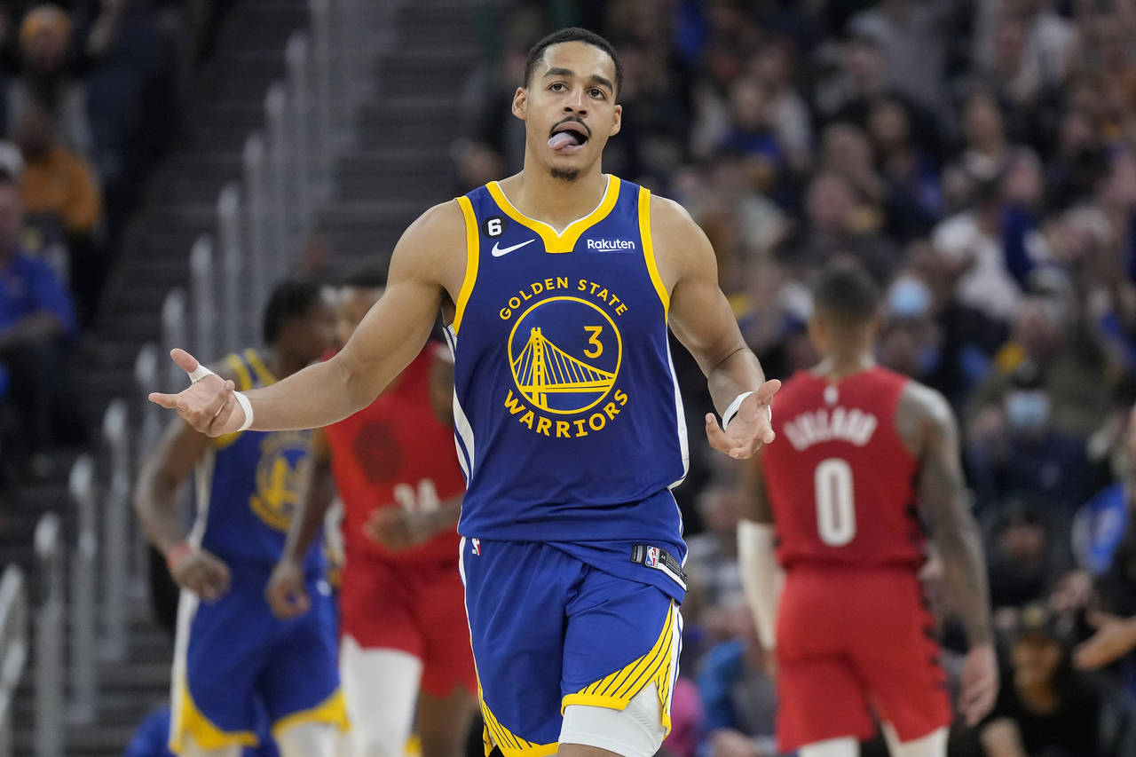 Golden State Warriors guard Jordan Poole (3) gestures after 3-point basket during the first half of...