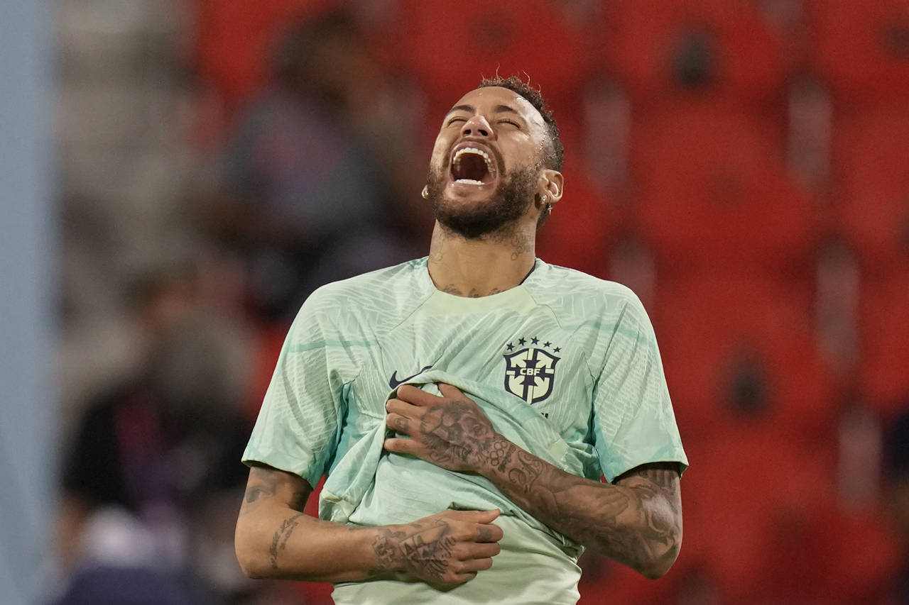 Brazil's Neymar smiles during a training session at the Grand Hamad stadium in Doha, Qatar, Sunday,...