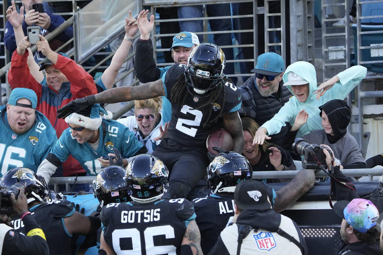 Jacksonville Jaguars safety Rayshawn Jenkins (2) celebrates with fans after an interception during ...