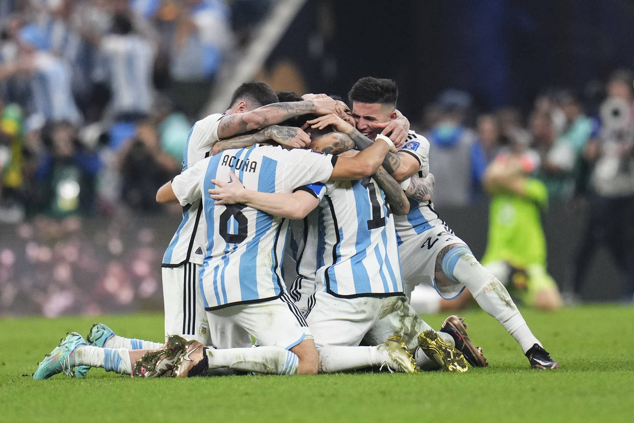 Argentina players celebrate winning the World Cup final soccer match between Argentina and France a...