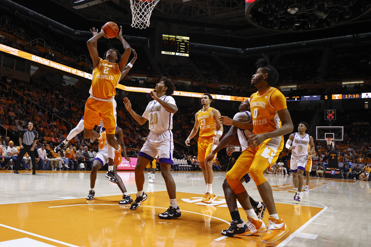 Tennessee forward Julian Phillips (2) shoots past Alcorn State forward Darryl Jordan (20) during th...