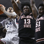 Hawkins leads unbeaten No. 8 UConn past Okla St 74-64