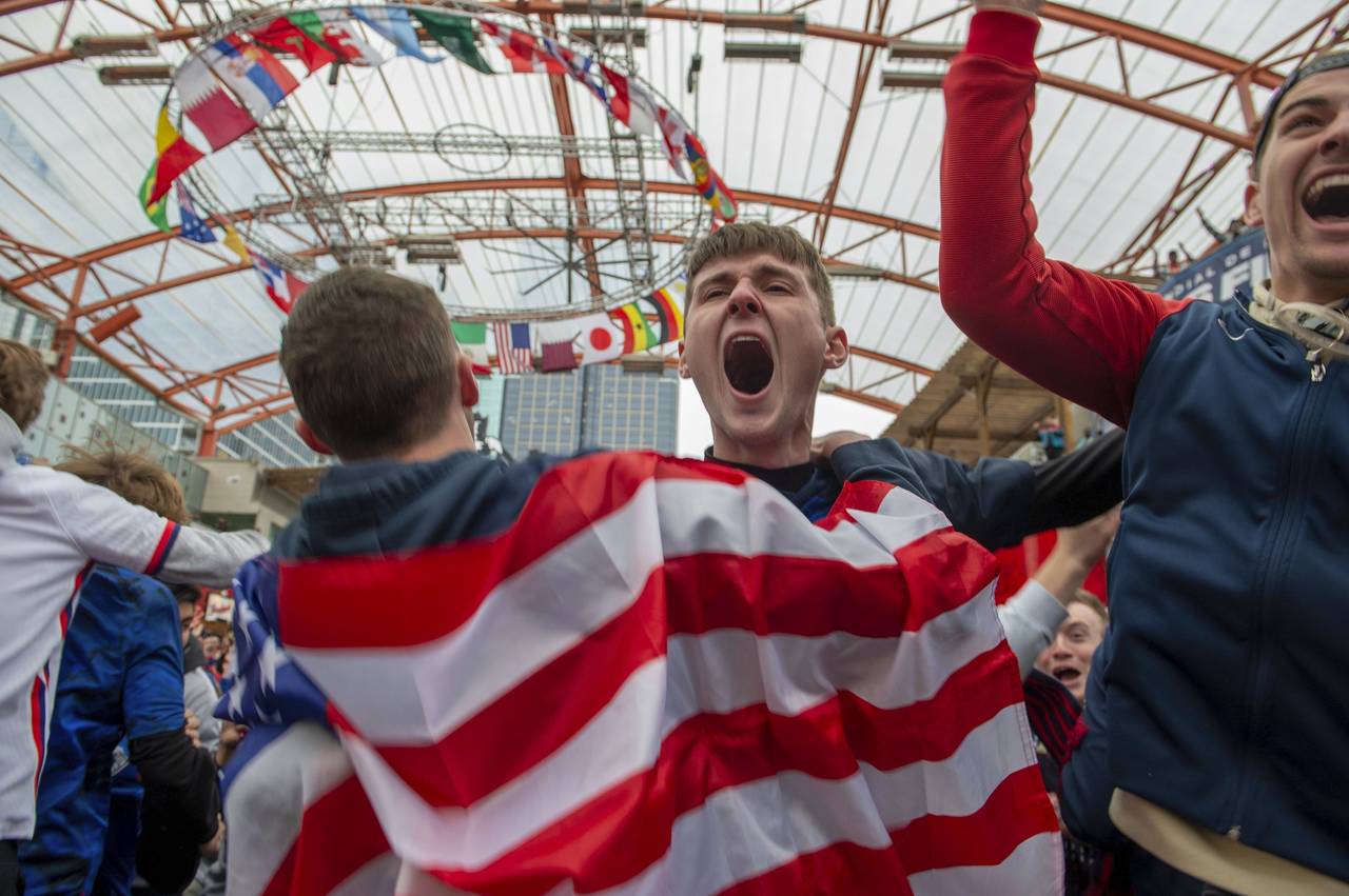 Peyton Olson, center, reacts to a goal scored by the United States during the Qatar World Cup group...