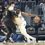 Cavaliers beat Mavericks 100-99 in OT on Allen's slam