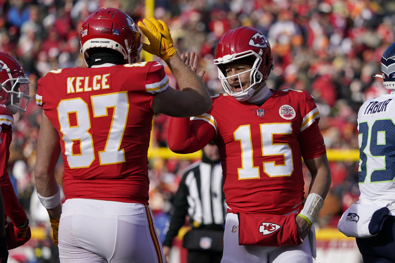 Kansas City Chiefs quarterback Patrick Mahomes (15) and tight end Travis Kelce (87) celebrate durin...