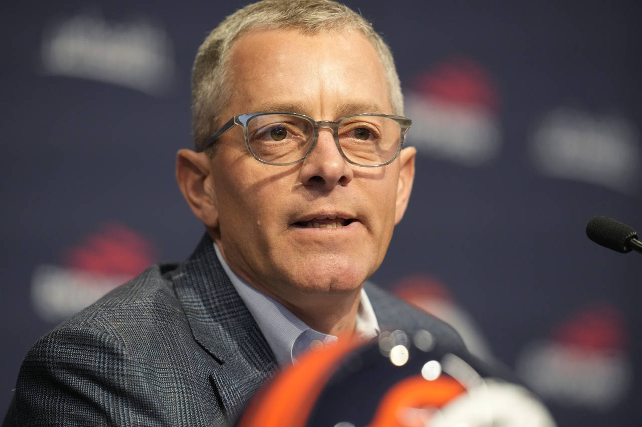Denver Broncos chief executive officer Greg Penner responds to a question during a news conference ...