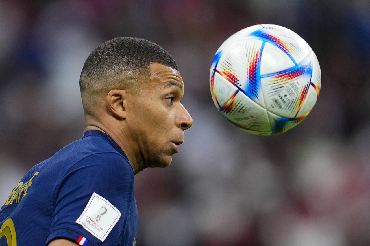 France's Kylian Mbappe attempts to control the ball during the World Cup quarterfinal soccer match ...