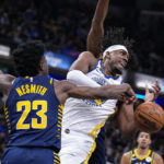 Curry injures shoulder, Pacers hold off Warriors 125-119