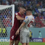 Serbia charged by FIFA for team, fans conduct at World Cup