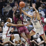 No. 9 UConn wins without Auriemma, topping Florida St 85-77