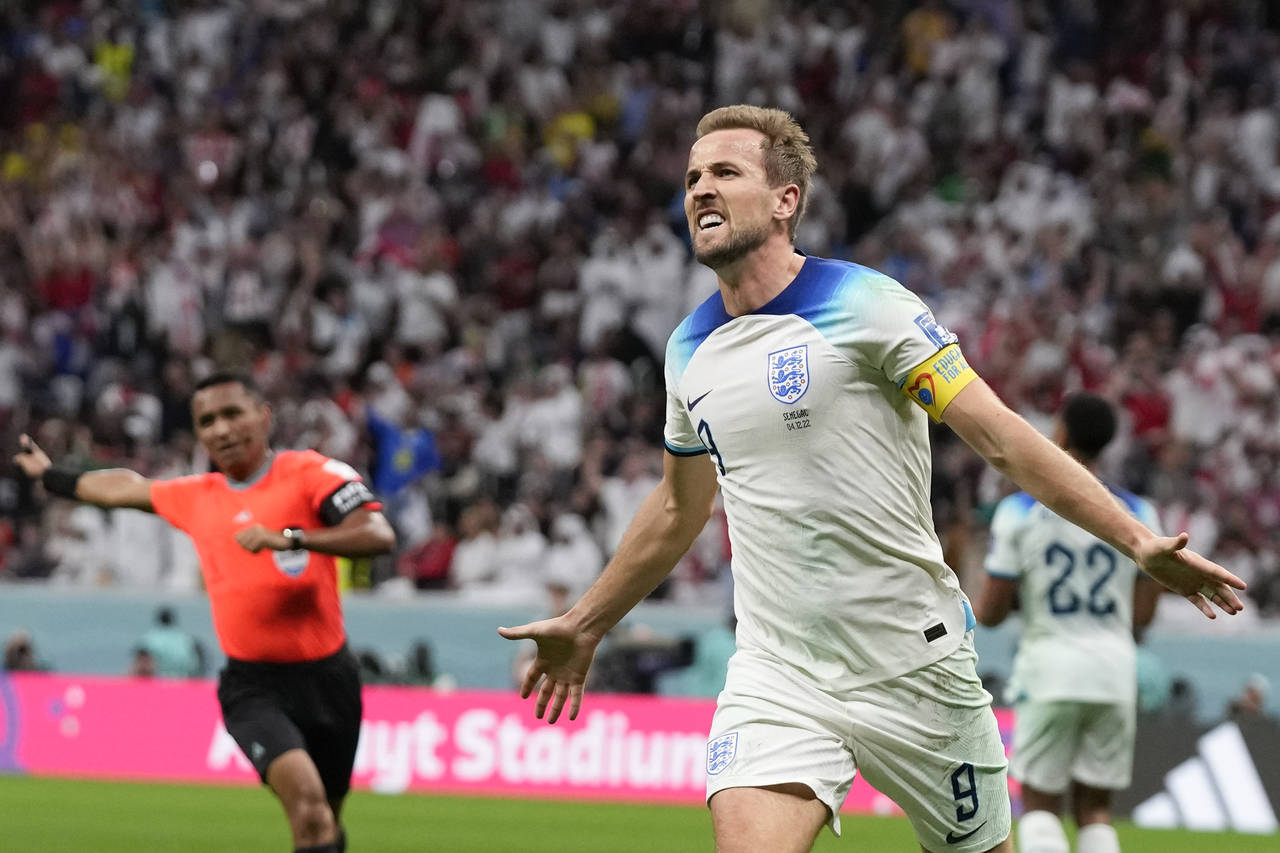 England's Harry Kane celebrates scoring his side's second goal during the World Cup round of 16 soc...