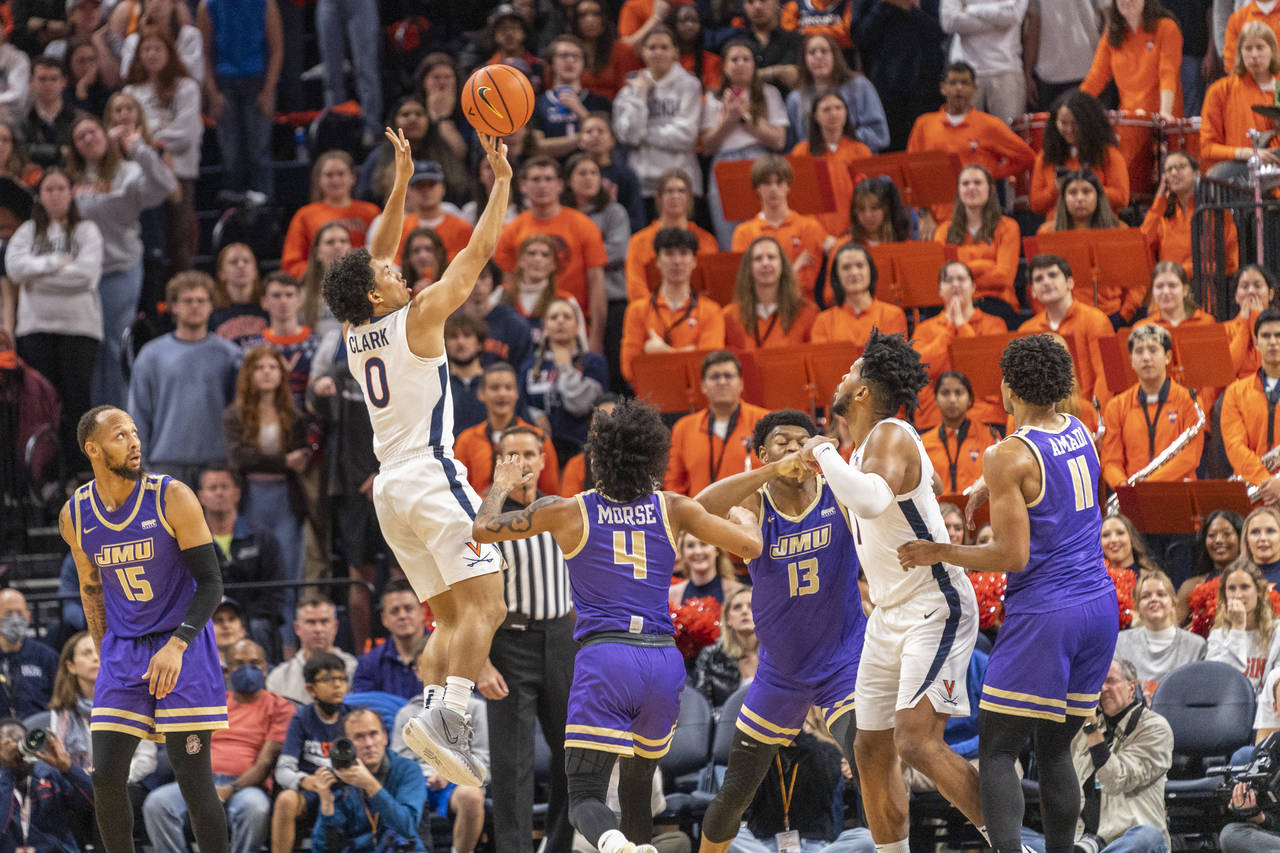 Virginia guard Kihei Clark (0) shoots against James Madison during the first half of an NCAA colleg...