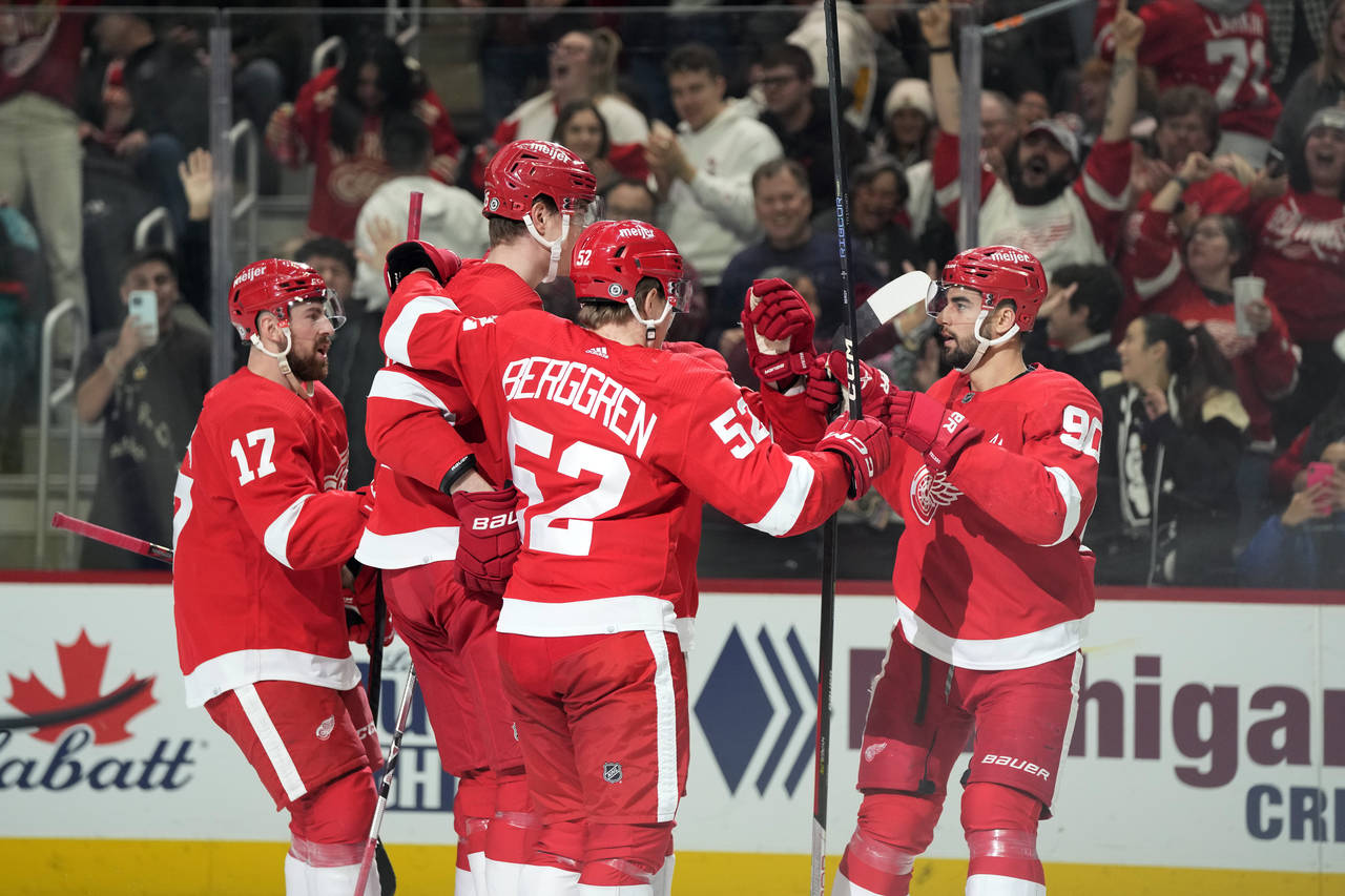 The Detroit Red Wings celebrate a goal by left wing Elmer Soderblom, second from left, during the t...