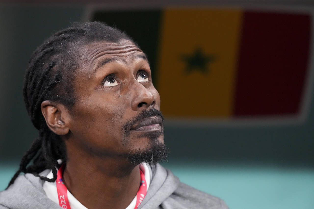 Senegal's head coach Aliou Cisse listens to the nationals anthems prior to the World Cup round of 1...