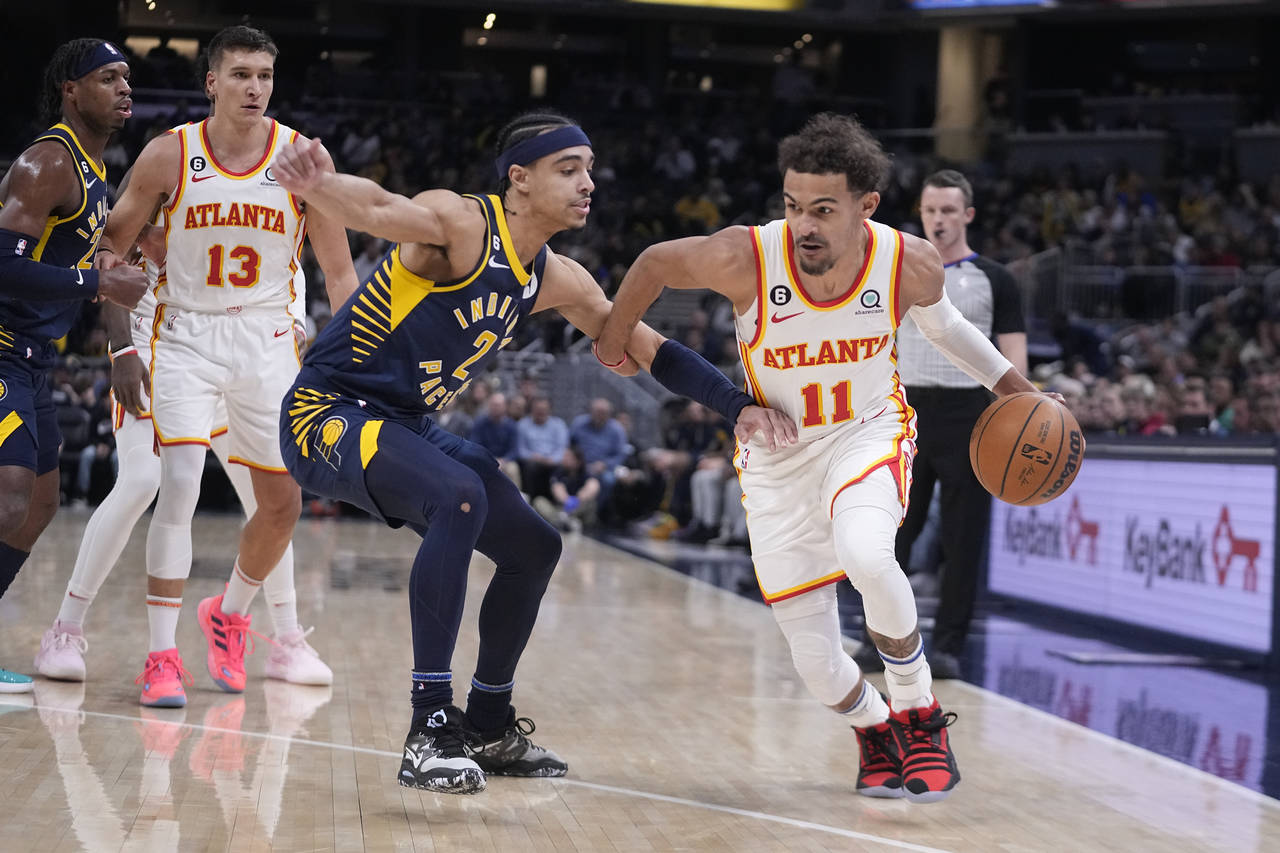 Atlanta Hawks' Trae Young (11) drives against Indiana Pacers' Andrew Nembhard (2) during the first ...