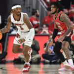 Louisville gets first win of season behind Ellis' 30 points