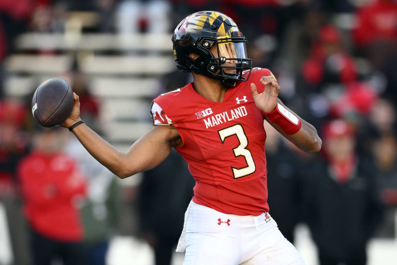 Maryland quarterback Taulia Tagovailoa (3) passes during the second half of an NCAA college footbal...