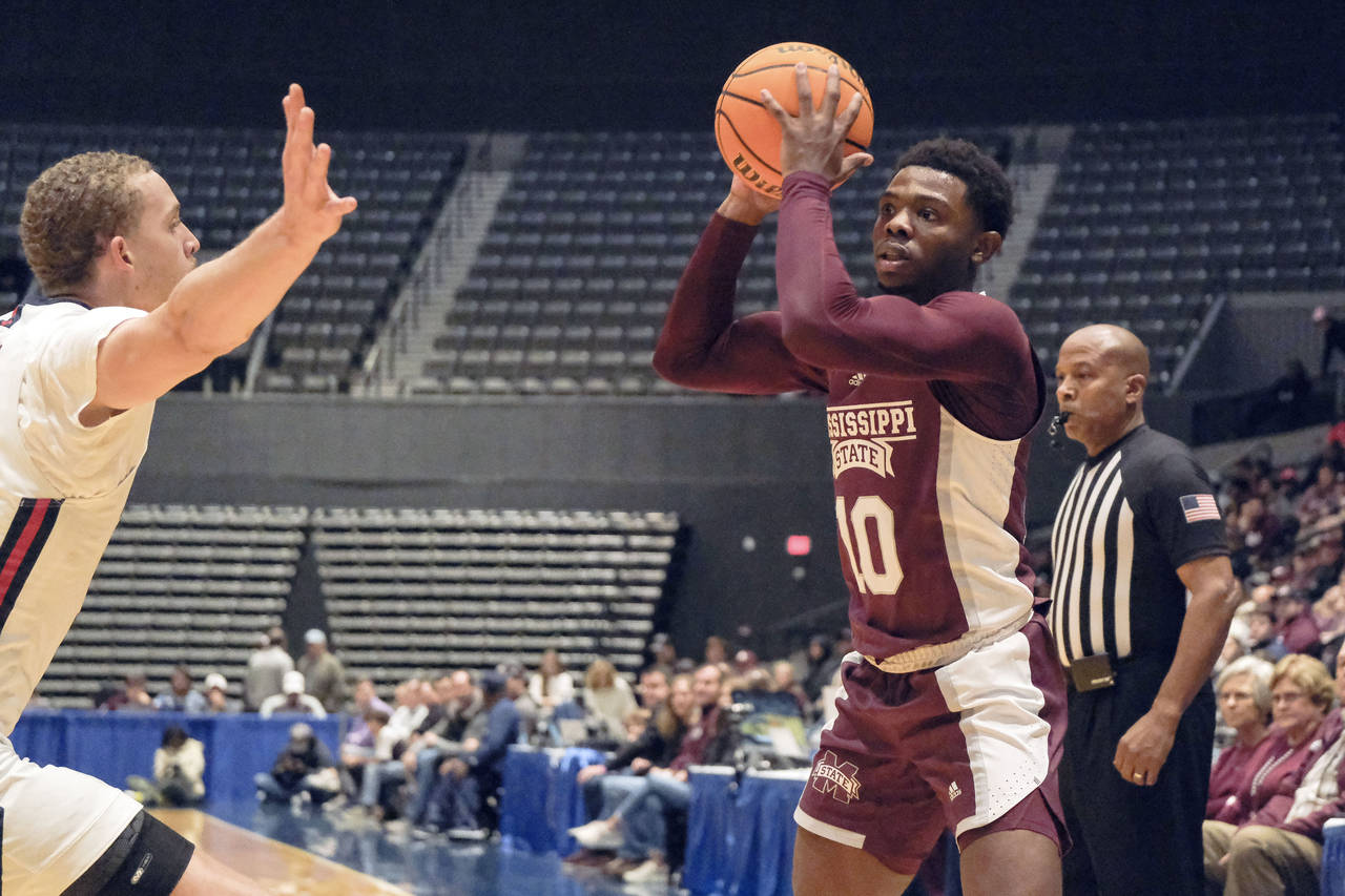 Mississippi State guard Dashawn Davis (10) takes a shot during the first half of an NCAA college ba...