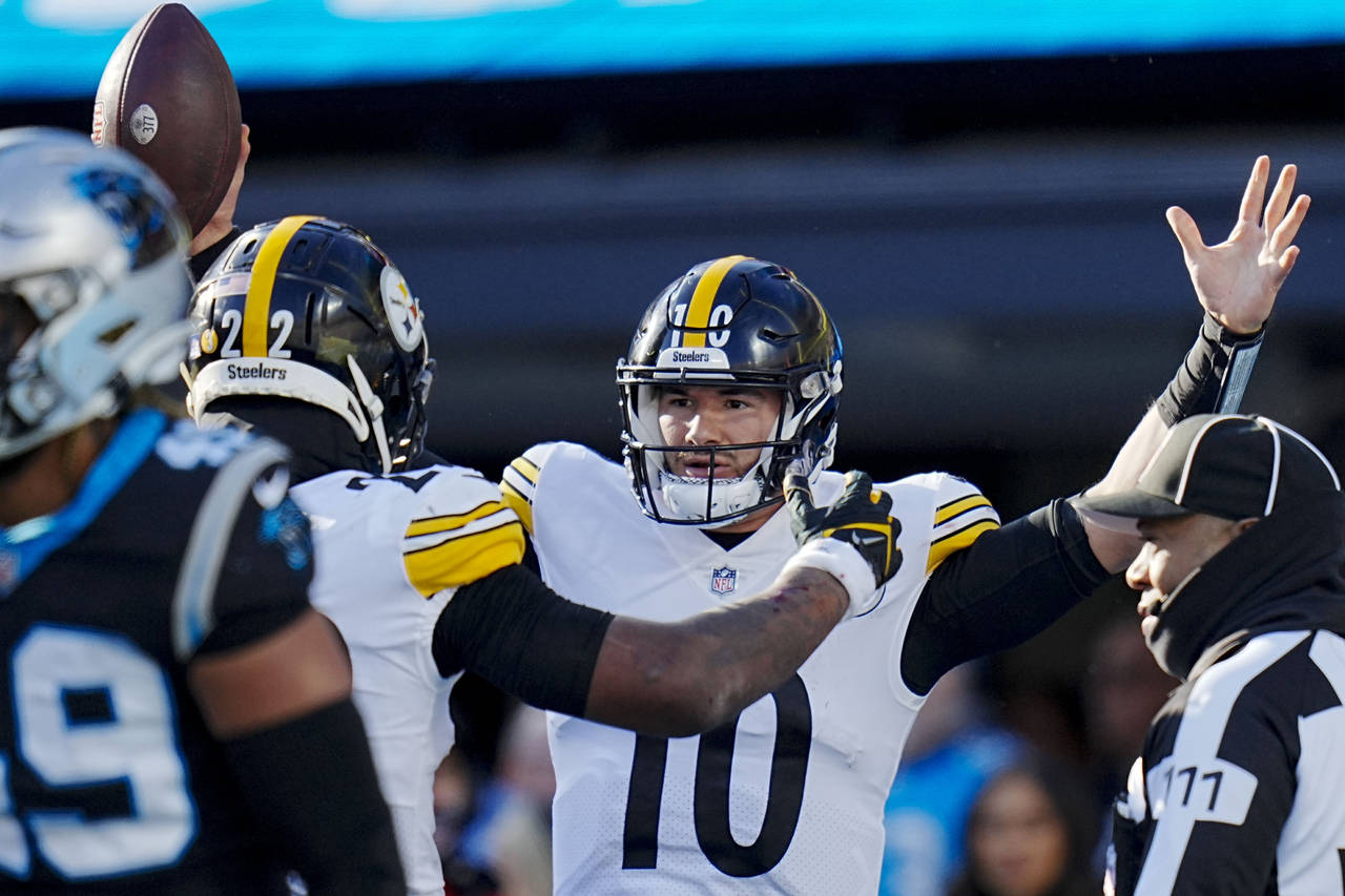 Pittsburgh Steelers quarterback Mitch Trubisky celebrates after scoring during the second half of a...