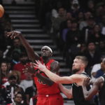 Fox has 27 points and 10 assists, Kings beat Raptors 124-123
