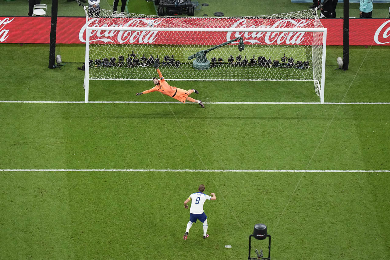 England's Harry Kane misses a penalty shot sending the ball over the bar as France's goalkeeper Hug...