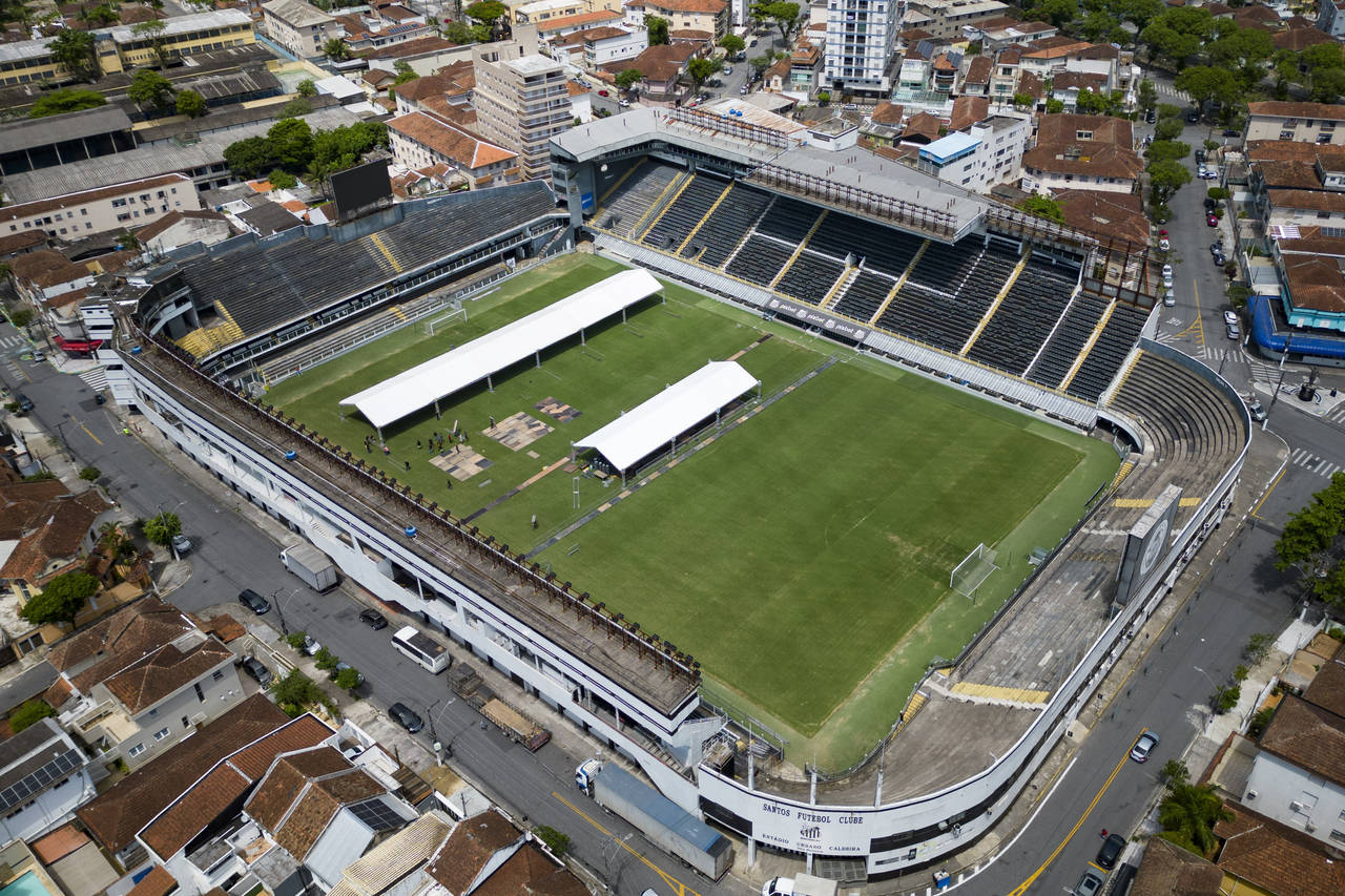 Workers set up tents at the Vila Belmiro stadium, the home of the Santos FC soccer club where socce...