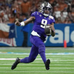 
              Washington quarterback Michael Penix Jr. (9) runs against Texas during the first half of the Alamo Bowl NCAA college football game in San Antonio, Thursday, Dec. 29, 2022. (AP Photo/Eric Gay)
            