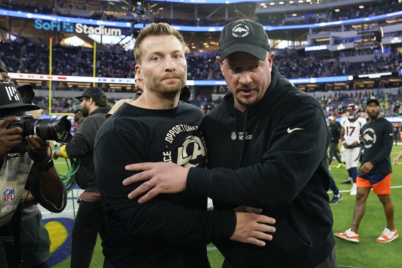 Los Angeles Rams head coach Sean McVay and Denver Broncos head coach Nathaniel Hackett leaves the f...
