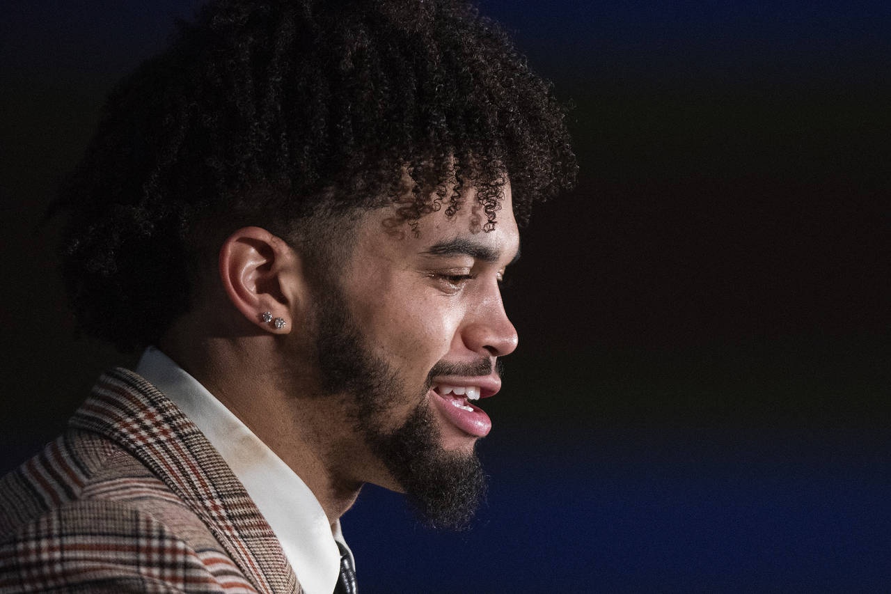 Southern California quarterback Caleb Williams speaks during a news conference after winning the He...