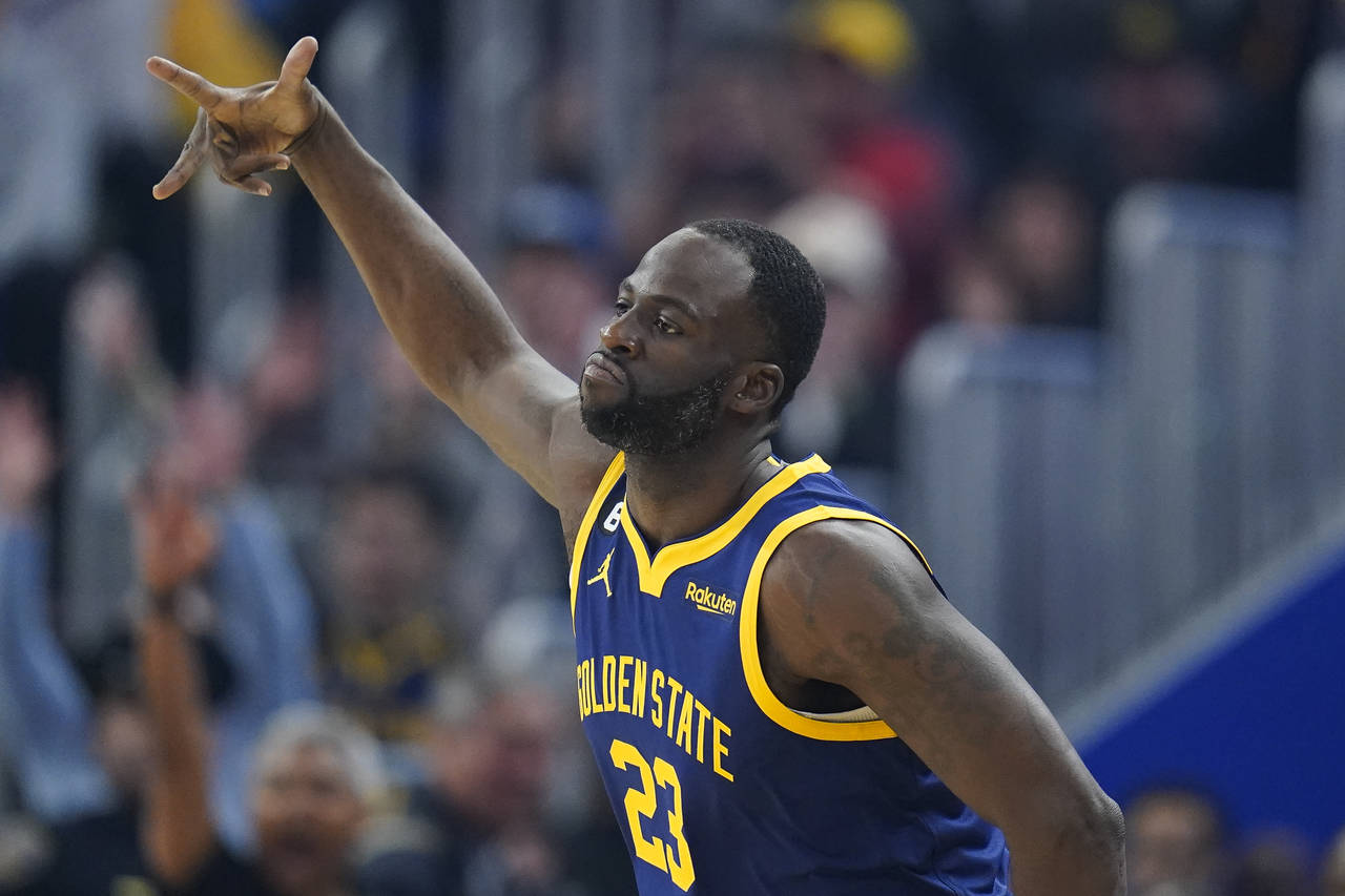 Golden State Warriors forward Draymond Green celebrates after scoring a 3-point basket against the ...
