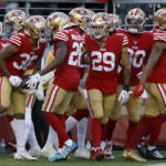 
              San Francisco 49ers cornerback Deommodore Lenoir, foreground left, celebrates with teammates after intercepting a pass during the second half of an NFL football game against the Miami Dolphins in Santa Clara, Calif., Sunday, Dec. 4, 2022. (AP Photo/Jed Jacobsohn)
            