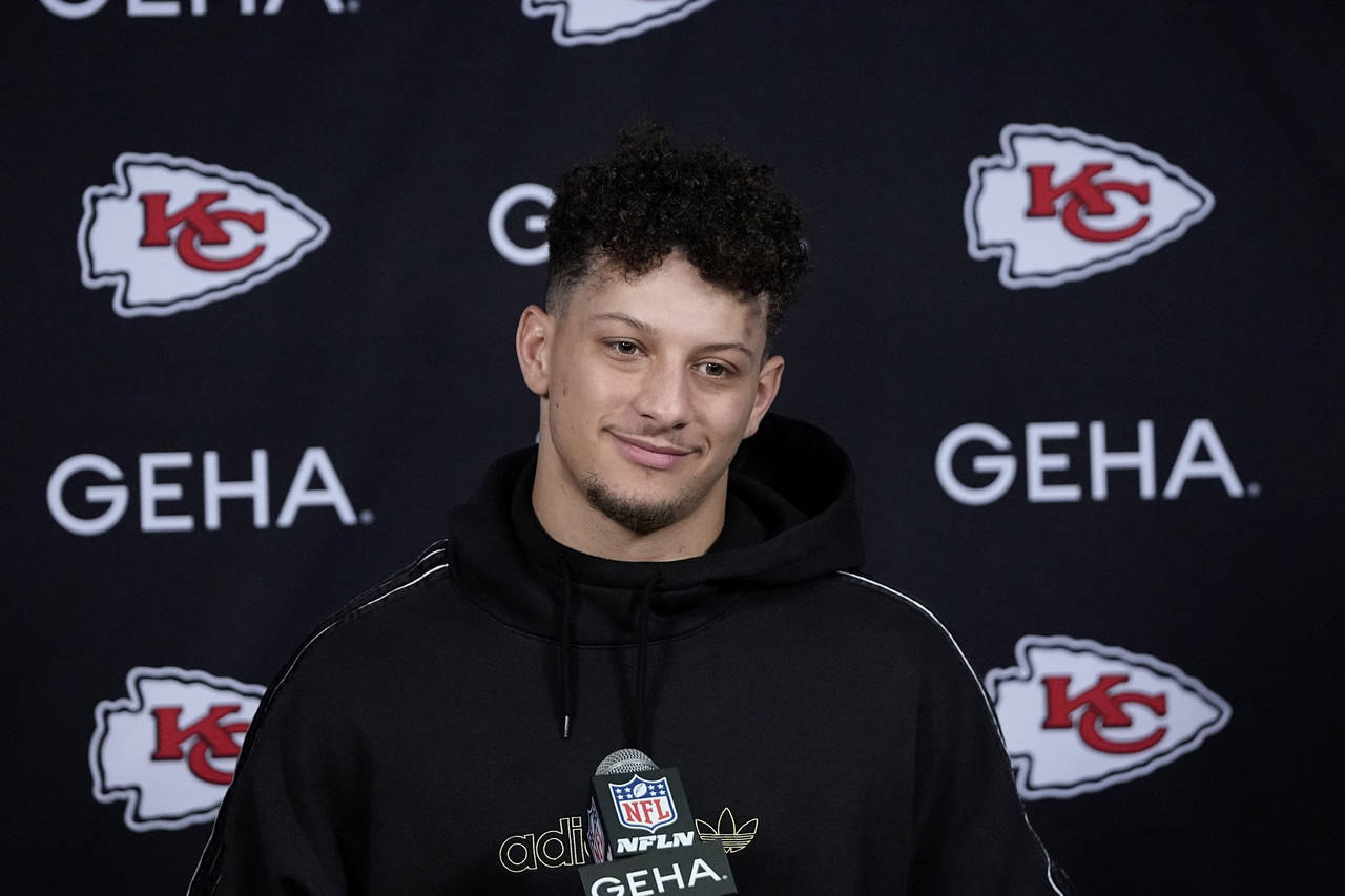 Kansas City Chiefs quarterback Patrick Mahomes listens to a question during a news conference after...