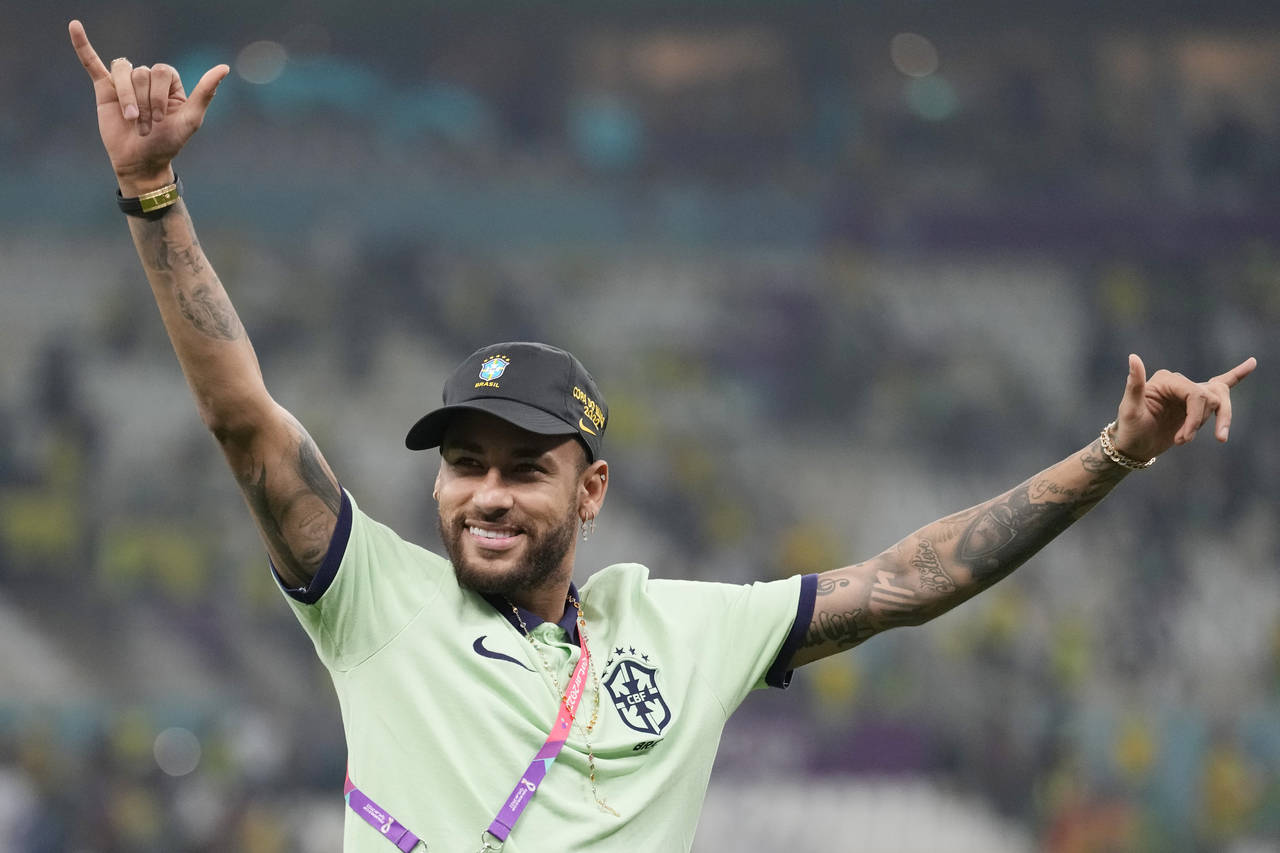 Brazil's Neymar greets the supporters after the World Cup group G soccer match between Cameroon and...