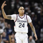 Hawkins leads unbeaten No. 8 UConn past Okla St 74-64