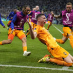 AP PHOTOS: World Cup highlights from Day 18