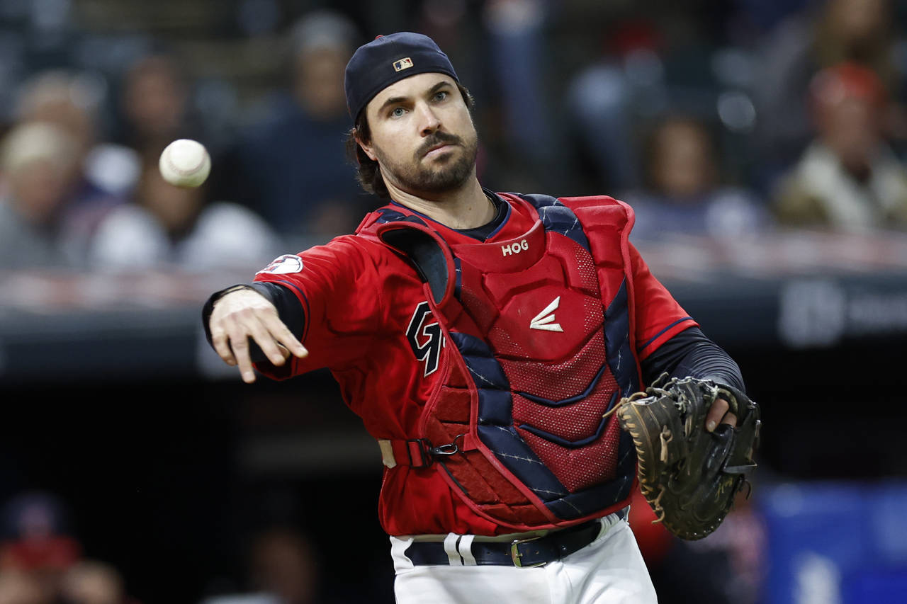 FILE -Cleveland Guardians catcher Austin Hedges throws out Tampa Bay Rays' Wander Franco at first b...