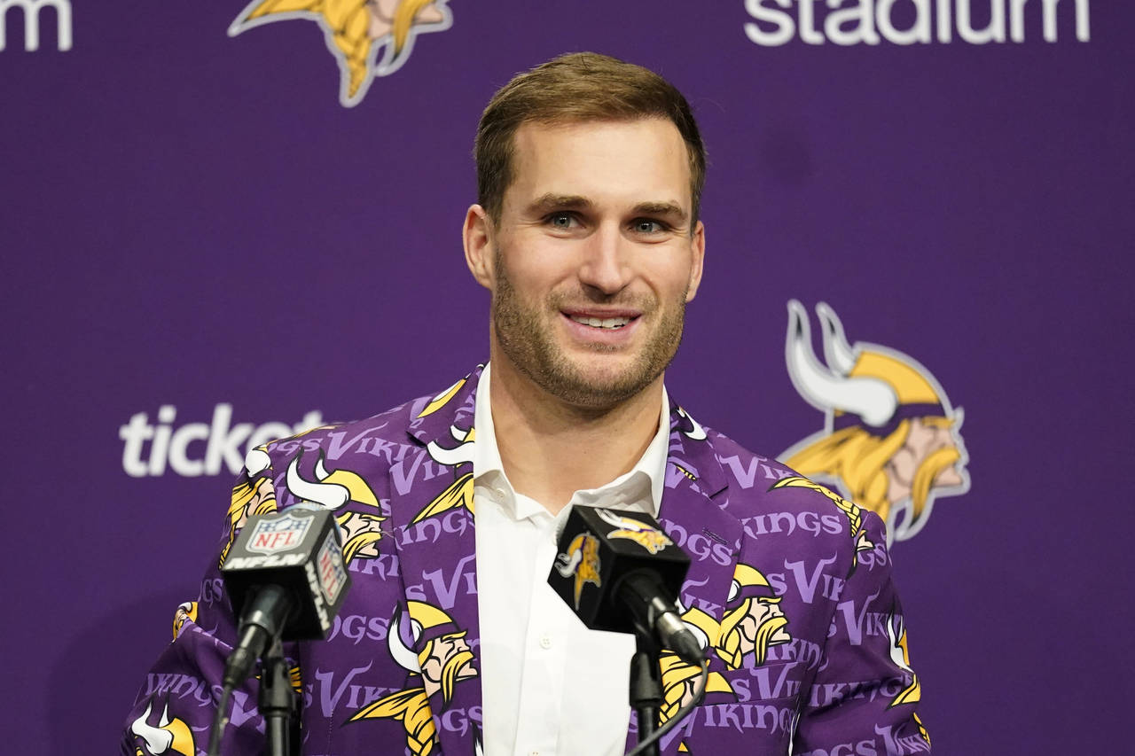 Minnesota Vikings quarterback Kirk Cousins speaks during a news conference after an NFL football ga...