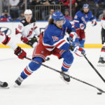 Rangers win 4-3 in OT to end Devils' 11-game road win streak