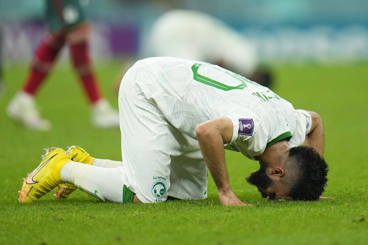 Saudi Arabia's Abdulrahman Al-Aboud kneels after losing 2-1 in the World Cup group C soccer match b...