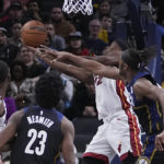Butler's late flurry helps Heat put away Pacers 87-82