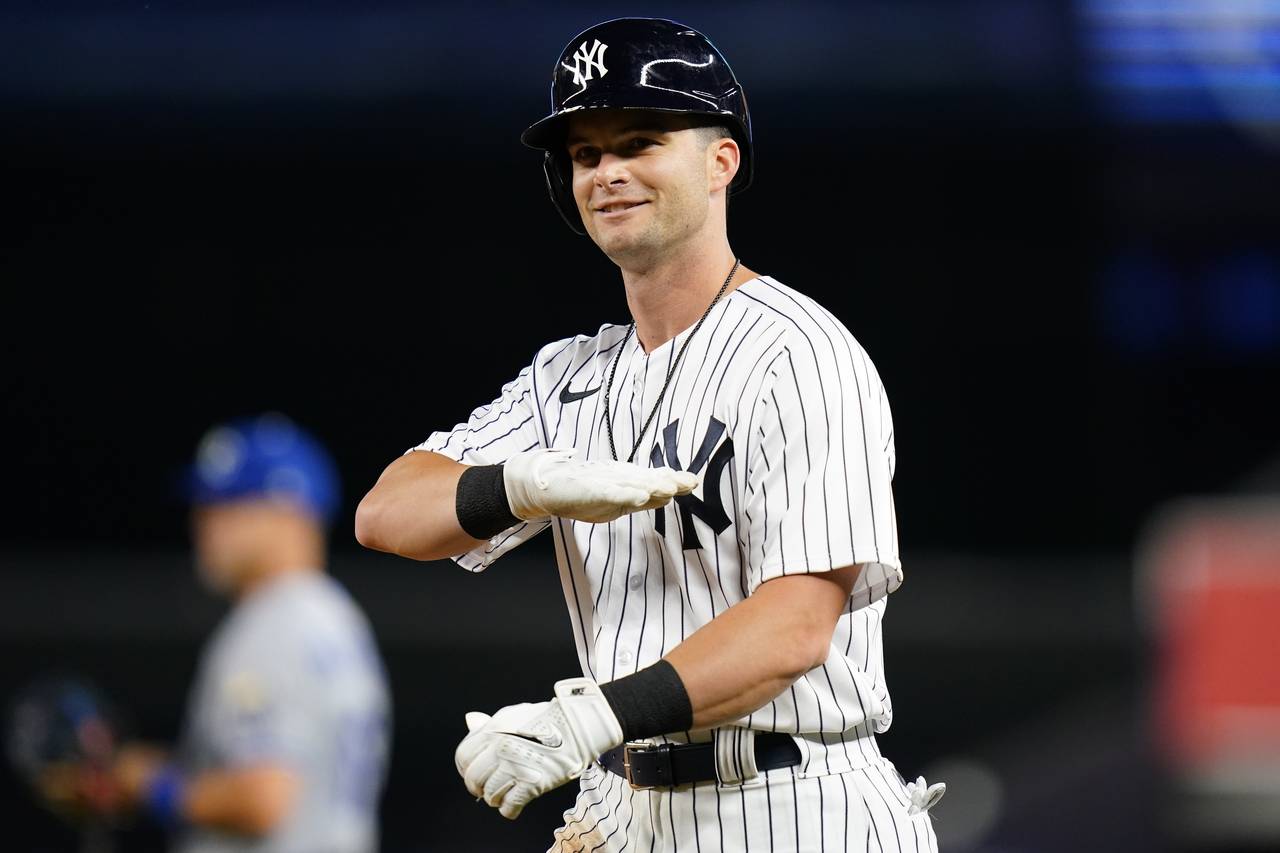 FILE - New York Yankees' Andrew Benintendi gestures toward teammates after hitting an RBI-single du...