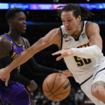Davis injured, but LeBron leads Lakers past Denver 126-108