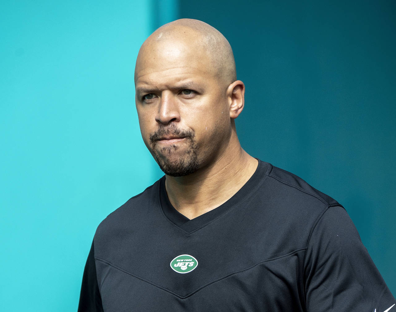 FILE - New York Jets wide receivers coach Miles Austin walks onto the field before an NFL football ...
