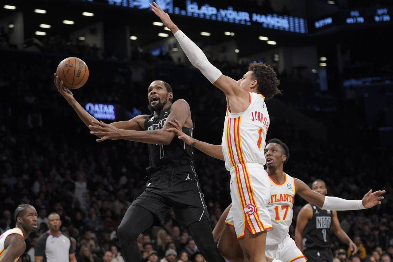 Brooklyn Nets forward Kevin Durant (7) goes to the basket against Atlanta Hawks forward Jalen Johns...