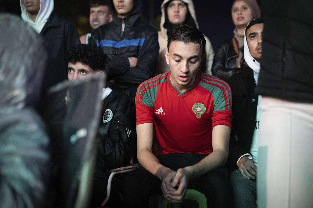 A Moroccan man reacts while watching the World Cup semifinal soccer match between France and Morocc...