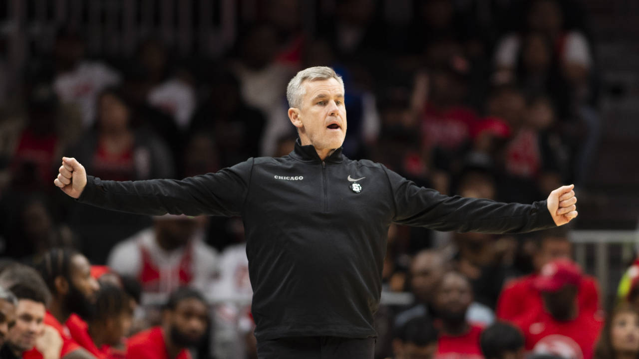 Chicago Bulls head coach Billy Donovan signals for a play during the first half of an NBA basketbal...