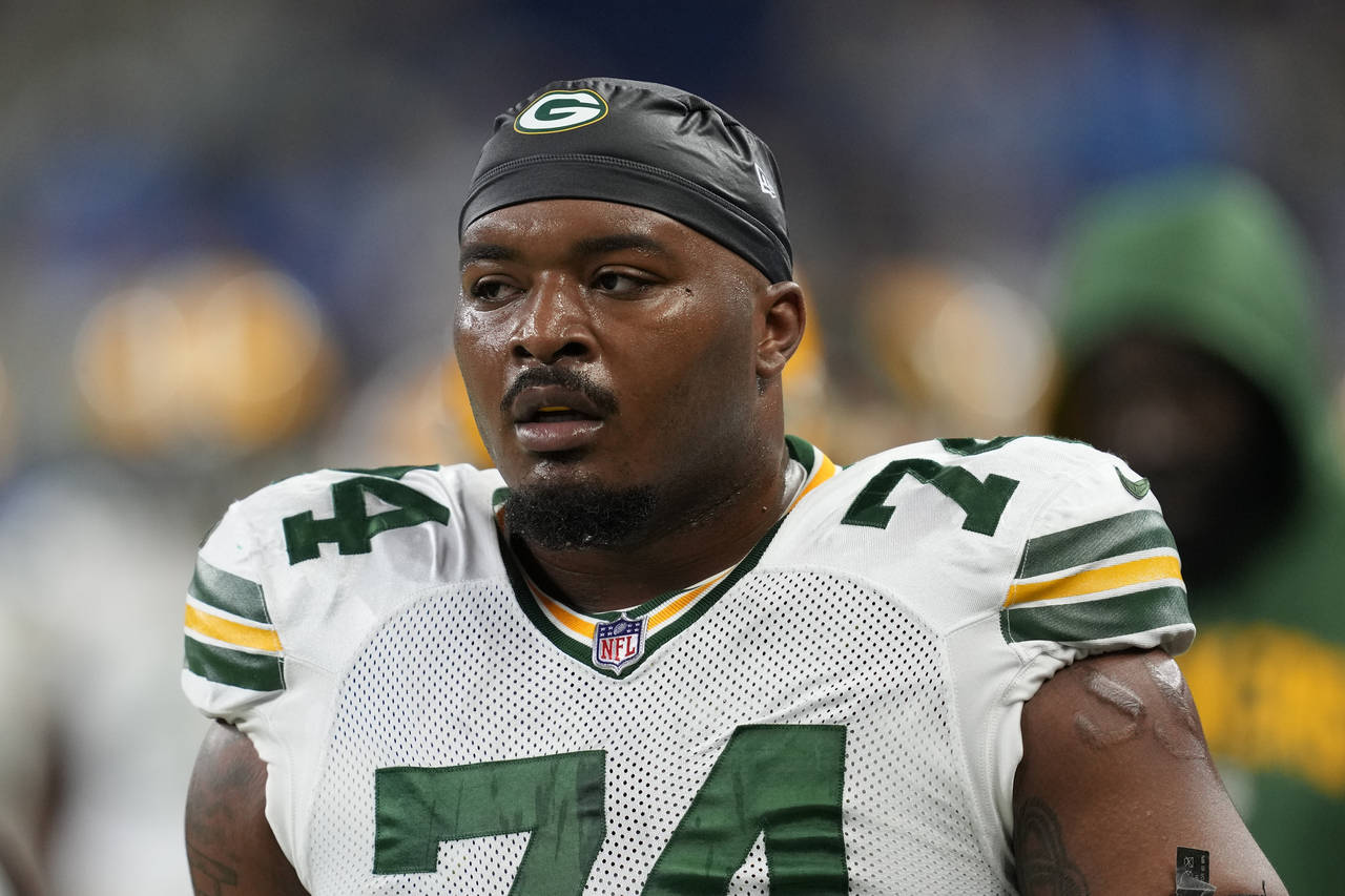 FILE - Green Bay Packers guard Elgton Jenkins (74) watches during an NFL football game against the ...