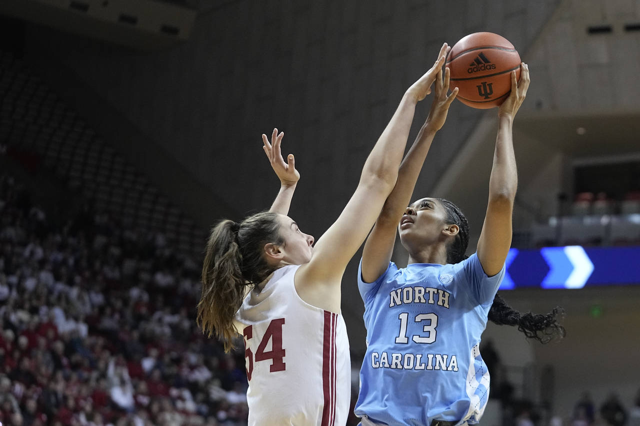 North Carolina's Teonni Key (13) shoots over Indiana's Mackenzie Holmes (54) during the first half ...