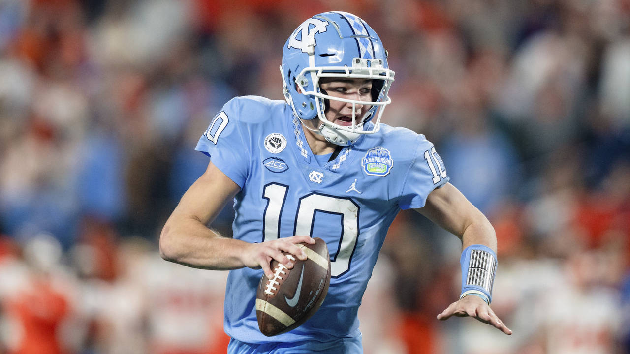 North Carolina quarterback Drake Maye (10) runs with the ball against Clemson during the Atlantic C...