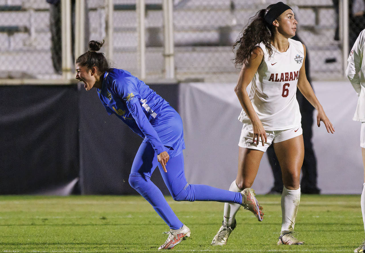 Madelyn Desiano (11) celebrates next to Alabama's Sasha Pickard (7) after scoring a goal during the...